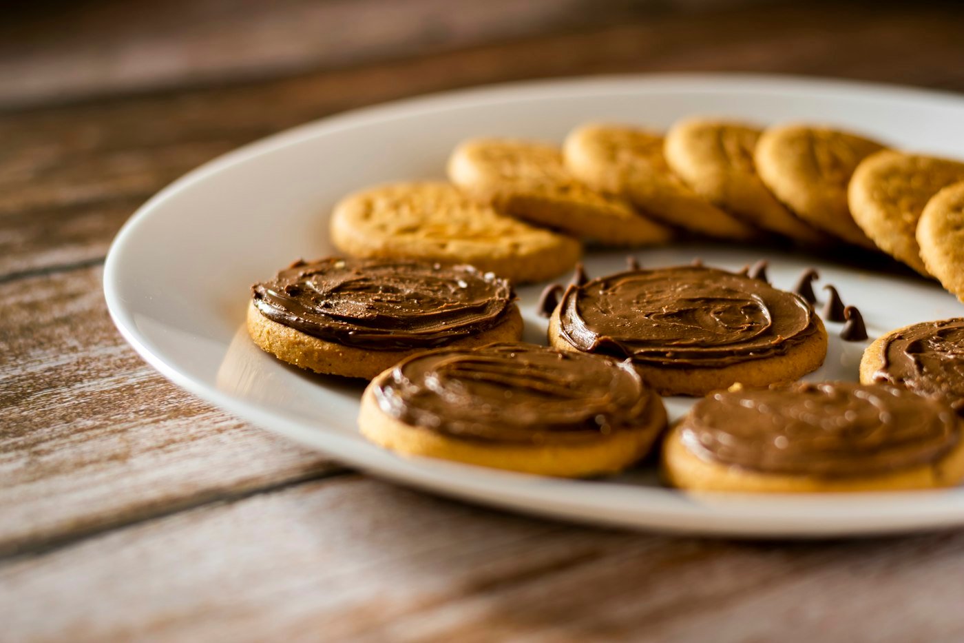 Plate of assorted biscuits and cookies on a wooden table